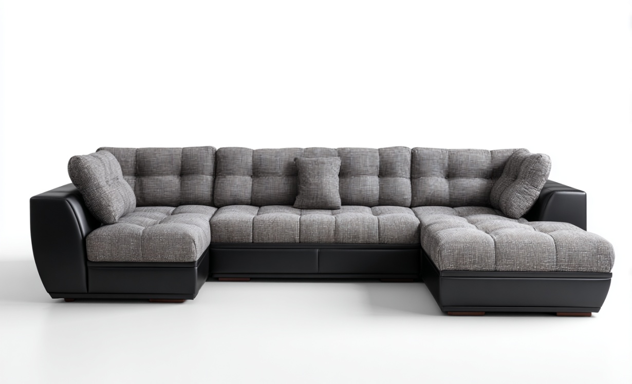 Gran sofá esquinero en forma de L con tela y piel en color negro y gris, con capacidad para seis personas.