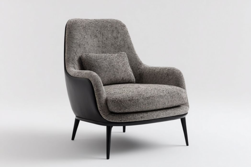 Sillón alto gris con carcasa exterior negra y patas metálicas, incluye cojín lumbar